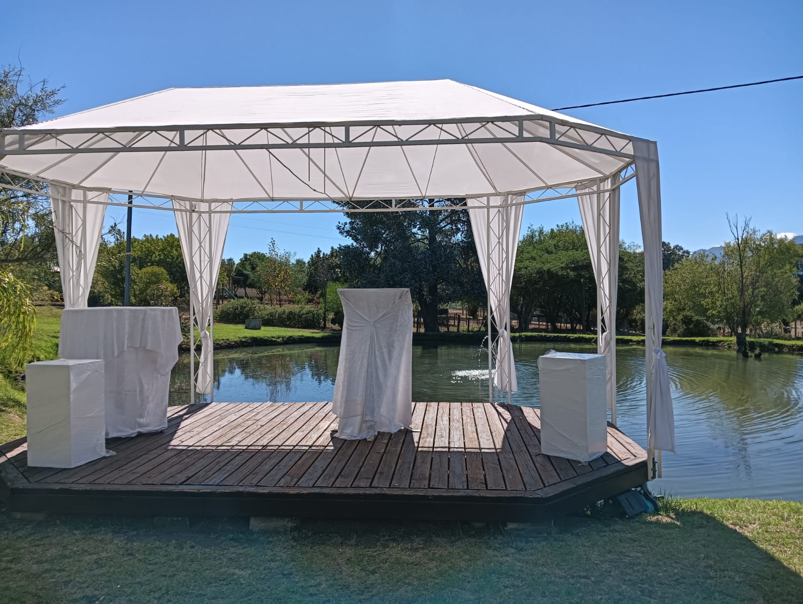 Outdoor wedding ceremony setup on the pond at Mayerskraal Wedding Venue