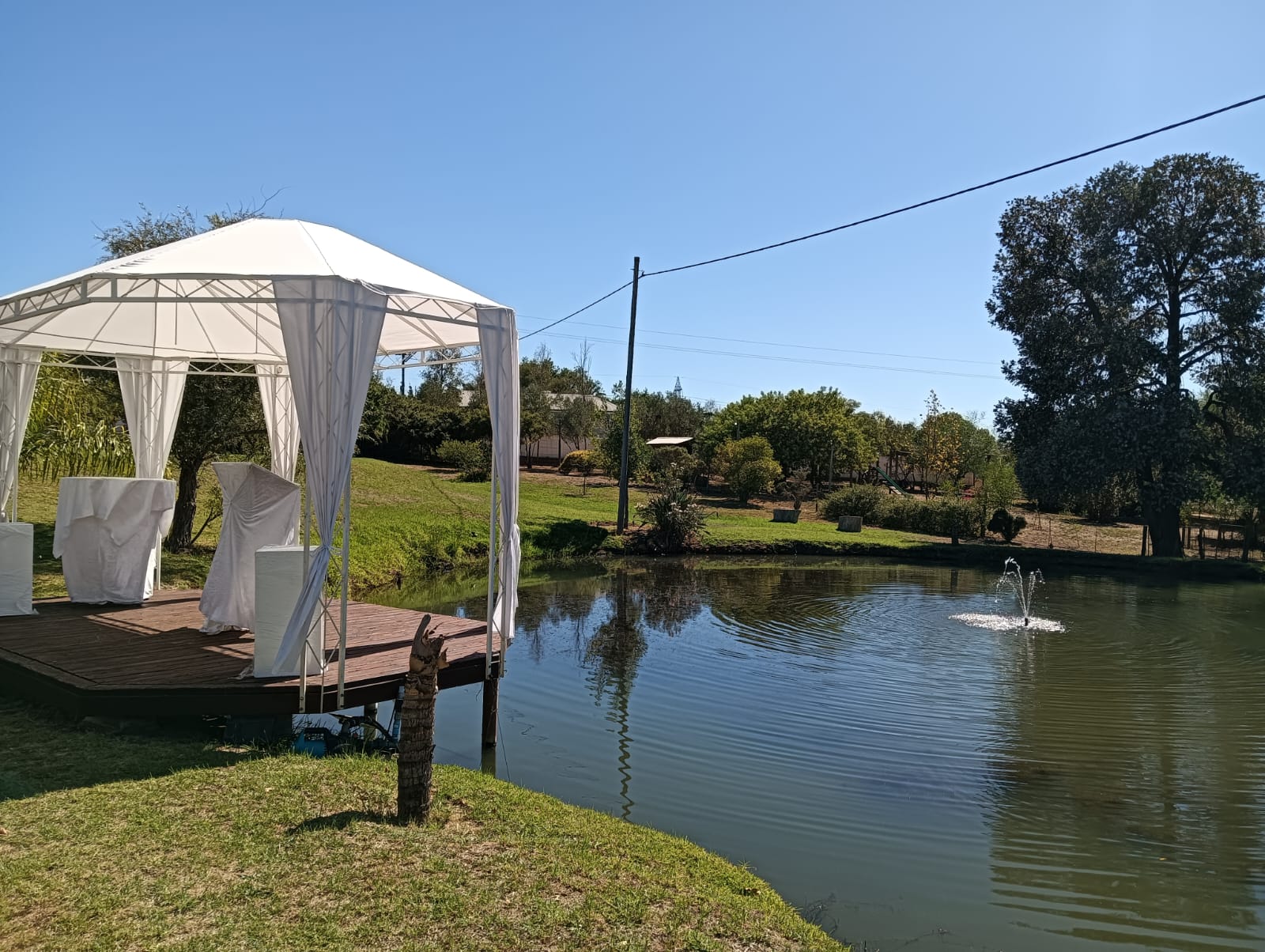 Outdoor wedding ceremony setup beside the pond at Mayerskraal Wedding Venue